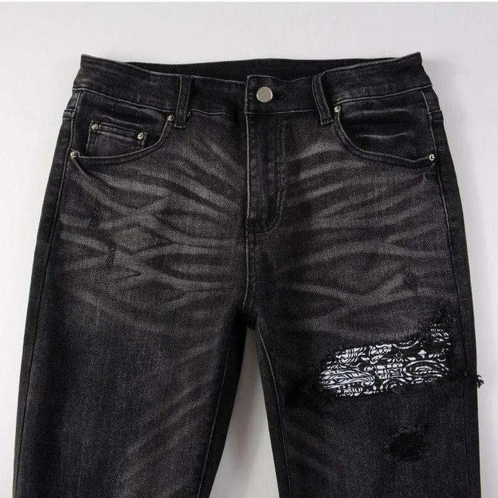 Vintage black ripped biker jeans